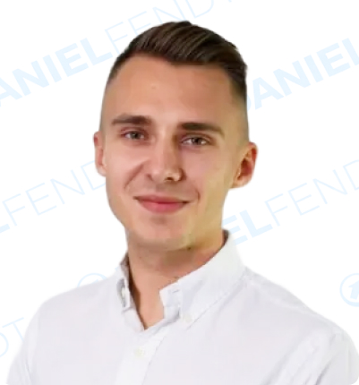 Smiling man in a white shirt.