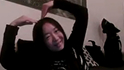 Person making a heart shape with hands.