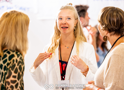 Young woman engaging in lively conversation.