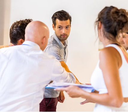 Group discussion with focused individuals in a meeting.