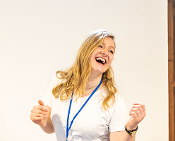 Woman joyfully engaging in a presentation