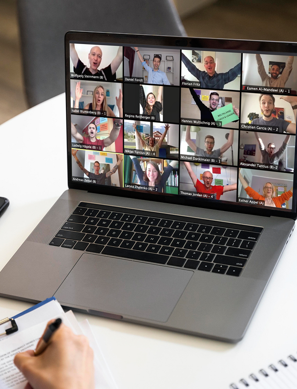 Group video call with participants celebrating together.