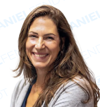 Smiling woman with long brown hair.