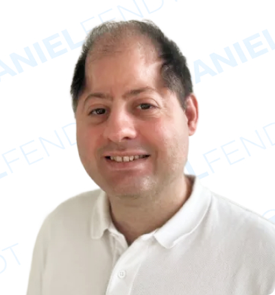 Smiling man in a white polo shirt